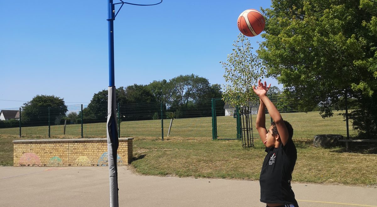 Young Person playing basketball